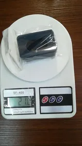 Weight display of a black nail art powder recycling box on a digital scale showing 21.6g