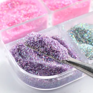 Macro shot of 6-grid nail glitter set with metal spoon picking up purple sugar powder