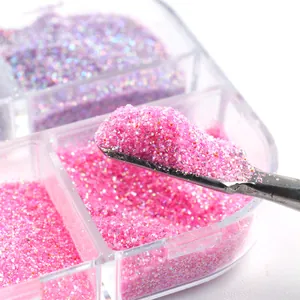 Macro detail of mixed magenta and purple nail glitter powder in a 6-slot storage case