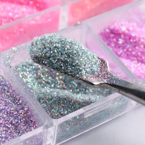 Macro shot of colorful nail glitter powder with stainless steel applicator tool