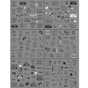 Detail view of 6 black and white nail stickers with Russian and English scripts and icons