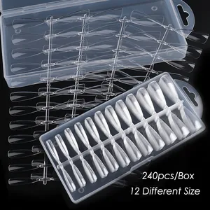 Macro shot of 240pcs transparent stiletto nail tips in a box with 12 different sizes