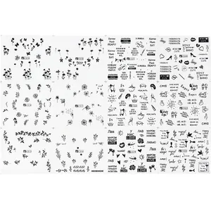 Set of 12 black nail art stickers featuring butterfly and floral patterns for manicure