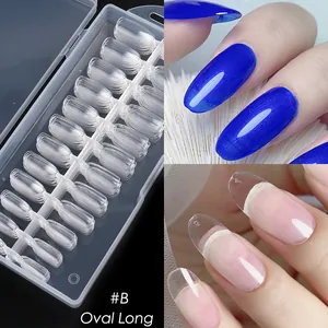 Macro view of #B long oval clear nail tips in organized box and glitter blue finish