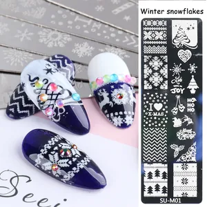 Macro shot of SU-M01 nail stamping plate with winter snowflake and reindeer patterns