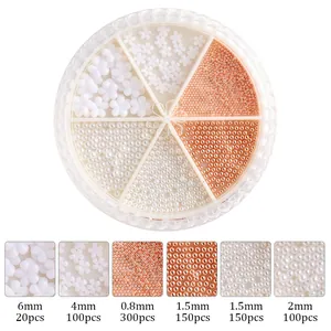 White flower and metallic bead nail art set in a six-grid round organizer wheel