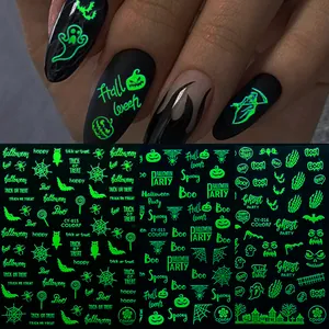 Luminous Halloween nail stickers showing glow-in-the-dark pumpkin and ghost designs