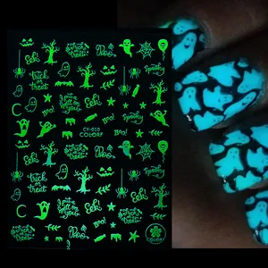 Luminous Halloween nail stickers showing ghost and pumpkin glow effects in the dark