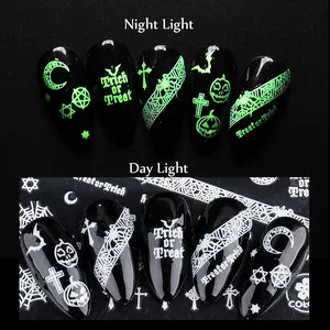 Luminous Halloween nail stickers showing glow-in-the-dark pumpkin and bat patterns