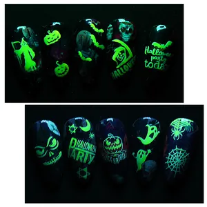 Glow-in-the-dark Halloween nail art stickers with neon pumpkin and skull patterns