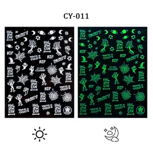 Luminous Halloween nail stickers with ghosts and pumpkins glowing in the dark