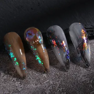Brillantina para uñas aurora opal con uñas postizas stiletto ámbar y gris diseño