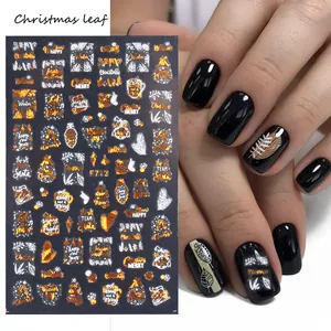 Detail of Christmas nail stickers F712 featuring gold snowflakes and festive leaves