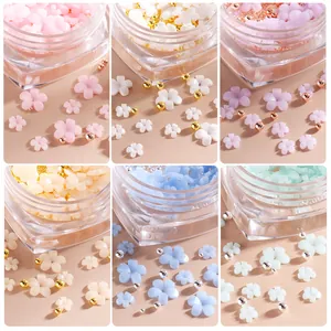 UV-sensitive 3D resin flower nail art charms set with metallic beads in heart-shaped boxes
