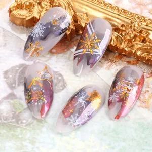 Christmas 3D nail stickers featuring gold laser snowflakes and reindeer patterns