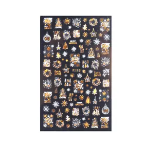 Gold and white 3D Christmas nail stickers with snowflake and reindeer patterns