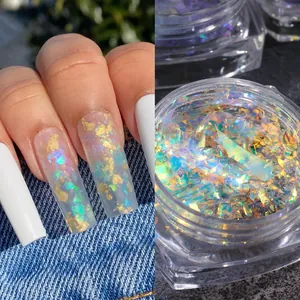 Macro shot of iridescent aurora opal nail flakes and gold foil in a square container