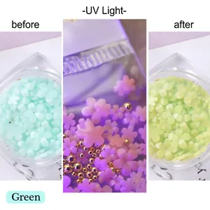 Macro view of green resin flower nail charms showing UV light color change effect