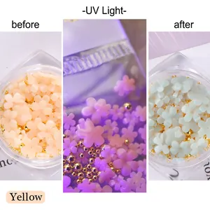 UV light photochromic flower nail charms showing yellow color change transition