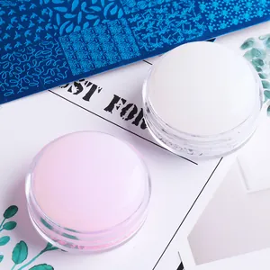 Detailed view of pink and white silicone nail art stamper kit with transparent base