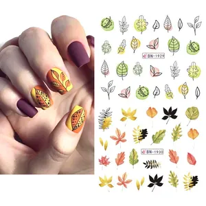 Fall nail art stickers with watercolor maple leaves and squirrel designs for autumn manicure