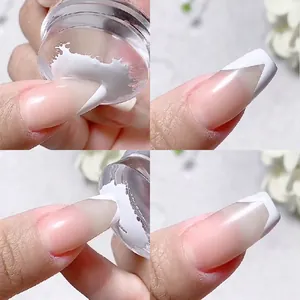 Macro shot of clear silicone nail stamper creating French manicure tips on fingernails