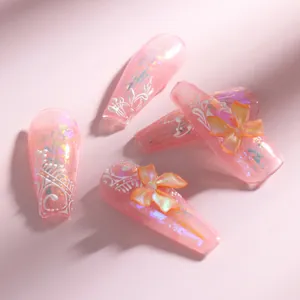 Detailed view of pink translucent aurora butterfly bow resin nail art decorations