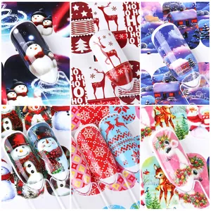 Christmas nail art water transfer stickers featuring snowman, reindeer and tree designs
