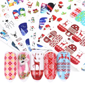 Detail view of Christmas nail stickers featuring Santa, snowflakes and festive patterns