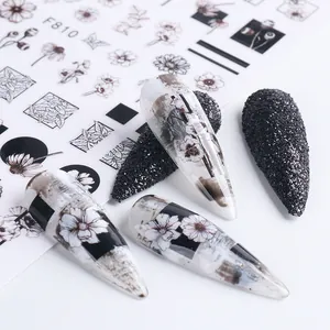 Minimalist black and white floral nail stickers featuring daisy designs and geometric art