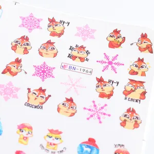 Detail of Christmas nail art stickers featuring squirrels, snowflakes, and Russian text