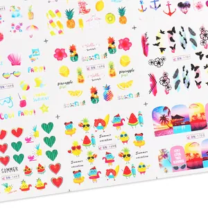 Detail of summer nail art stickers featuring tropical fruits, palm trees and beach motifs