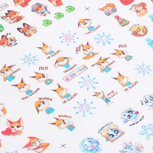 Close-up of BN-1960 nail art stickers with cute cartoon foxes and winter snowflake motifs