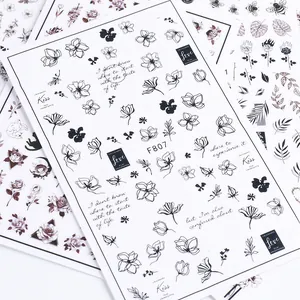 Floral black nail art stickers featuring bees and roses for elegant manicure designs