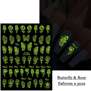 Luminous nail art stickers featuring butterfly and rose patterns in green glow