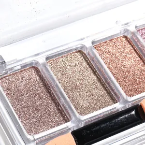 Detailed macro view of 3-color solid mirror nail powder palette with metallic glitter finish