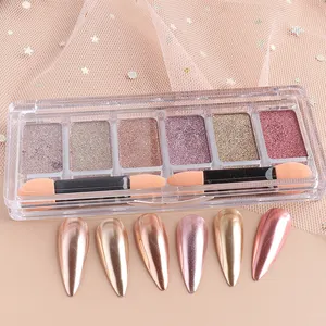 Macro detail of 6-color solid mirror nail powder palette with metallic chrome finish swatches