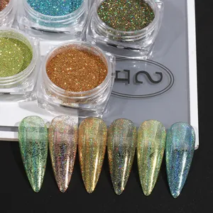 Close-up of holographic laser nail glitter powders in six colors and sample nail tips