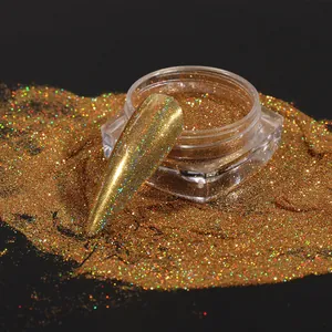 Macro detail of holographic gold nail glitter powder in a clear container with swatch