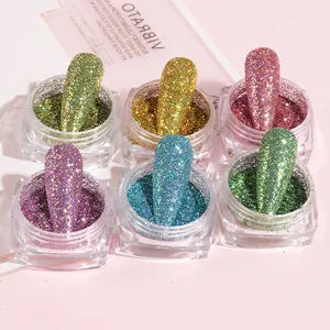 Macro detail of six-color nail laser glitter jars with sample tips on a pink background