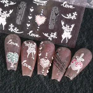 Detail view of 5D embossed nail stickers with love motifs and glittery press-on nails