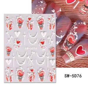 Detail of 5D embossed heart and love tree nail art stickers with textured 3D relief finish