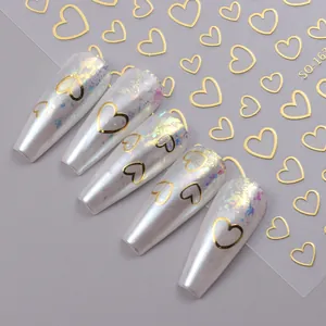 Macro shot of 3D gold heart nail stickers model SO-163 with minimalist line designs