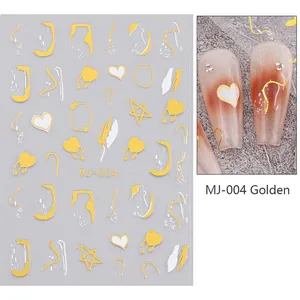Macro detail of MJ-004 3D gold heart nail stickers with abstract metallic fluid lines