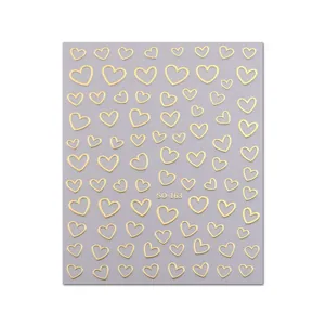 Minimalist 3D gold heart nail art stickers featuring irregular lines on a grey card