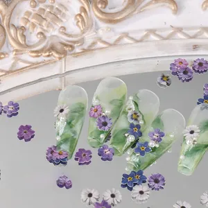 Detailed view of green marble coffin press-on nails with 3D flowers and pearls