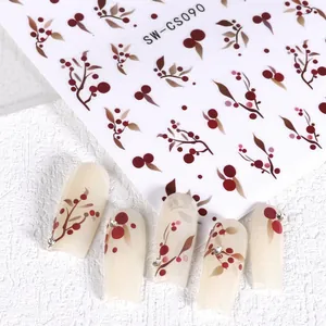 Détail des stickers ongles SW-CS090 avec baies rouges, feuilles et accents de strass