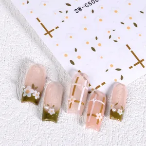 Détail des stickers ongles SW-CS081 avec marguerites blanches et motifs à carreaux verts