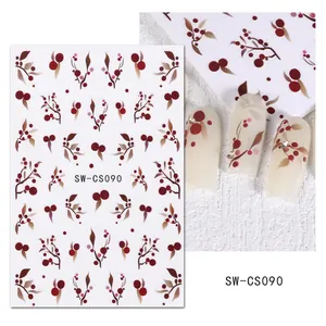 Détail des stickers ongles SW-CS090 avec baies rouges et motifs de feuilles brunes