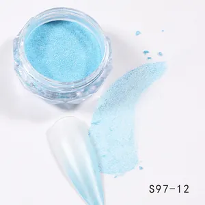 Detail of light blue aurora nail powder showing a smooth pearlescent chrome finish